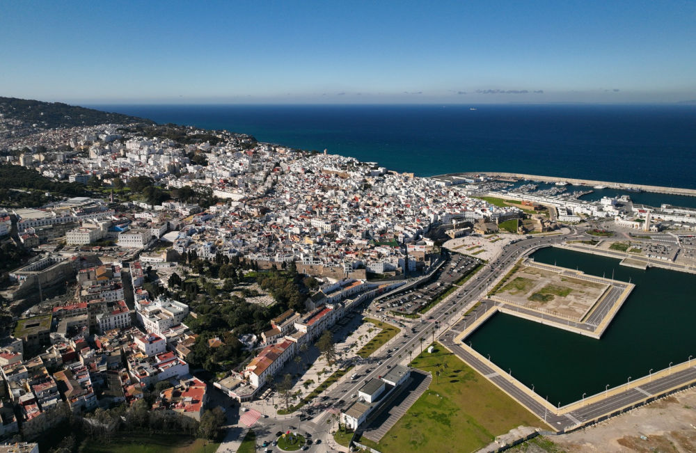 a sky view picture of a city overlooking the sea